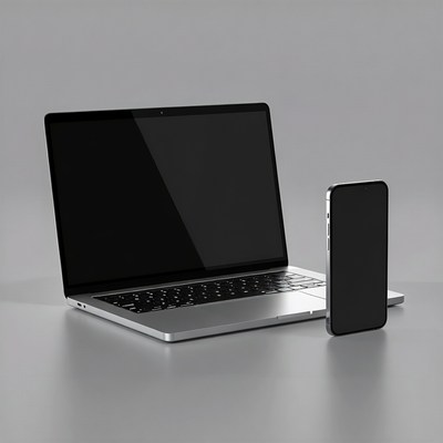 Silver MacBook Pro and iPhone on gray surface