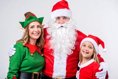 Santa elf mom and girl smiling together