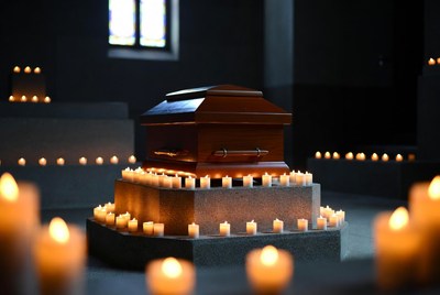Wooden Coffin Surrounded by Candles