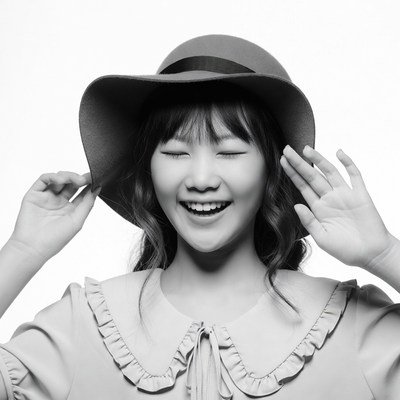 Asian girl smiling in wide-brim hat