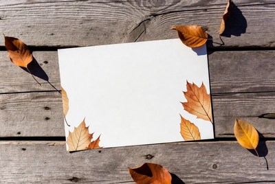 Blank Card with Autumn Leaves on Wood
