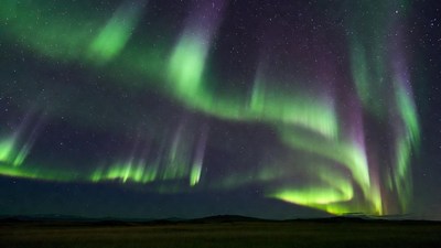 Northern Lights over grassy field