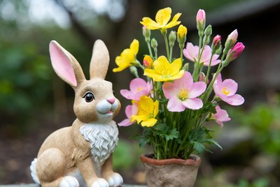 Bunny figurine with yellow pink flowers