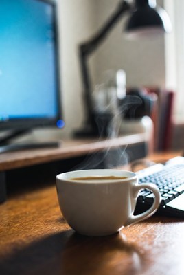Steaming Coffee Cup on Desk