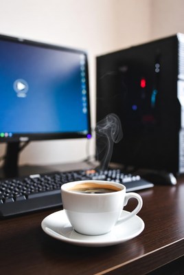 Hot Coffee Beside Computer