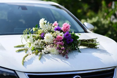 Flower Bouquet on White Car Hood