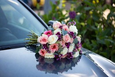 Wedding bouquet on car hood
