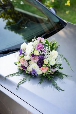 Wedding bouquet on car hood