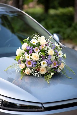 Wedding bouquet on car hood