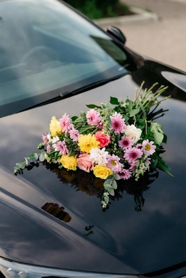 Colorful Bouquet on Black Car Hood