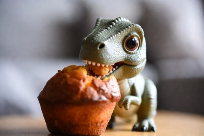 T-Rex toy eating muffin