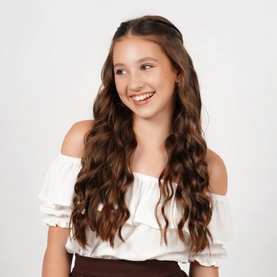Smiling girl in off-shoulder top