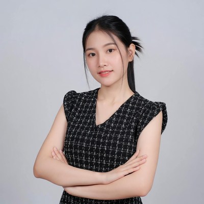 Asian woman arms crossed smiling