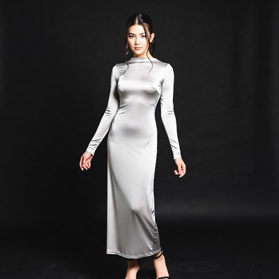 Asian woman in silver satin dress