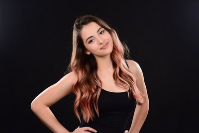 Smiling woman with pink ombre hair