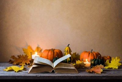 Open Book with Pumpkins and Autumn Leaves