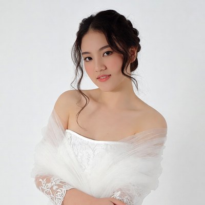 Asian woman in white lace gown