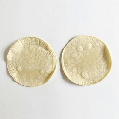 Two Corn Tortillas on White Background