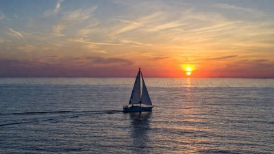 Sailboat Sailing at Sunset