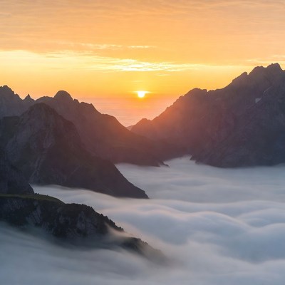 Sunrise over Mountains and Clouds