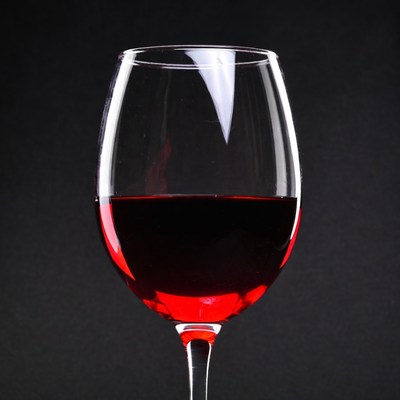 Red Wine Glass on Black Background