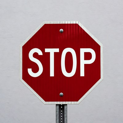 Red stop sign on pole