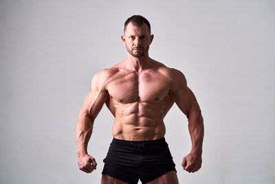 Muscular man posing in shorts
