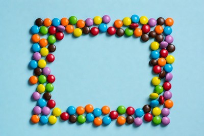 Colorful Candy Border on Blue Background