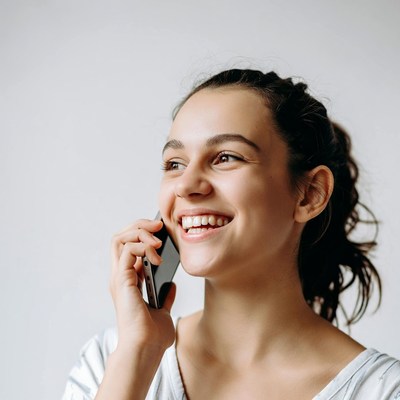 Smiling woman talking on phone