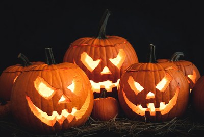 Carved Jack-o-Lantern Pumpkins on Black Background