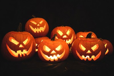 Group of lit jack-o-lantern pumpkins