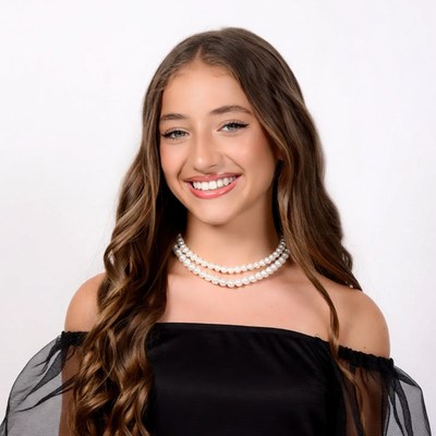 Smiling girl with pearl necklace