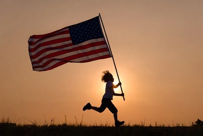 Girl running with American flag silhouette