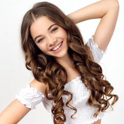 Smiling girl with long wavy hair