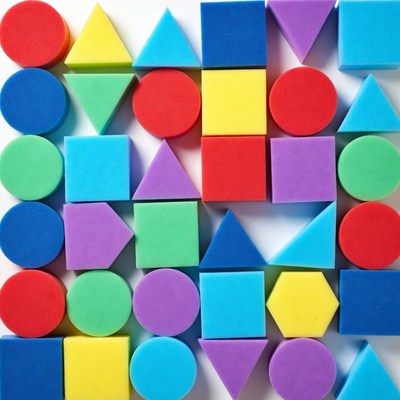 Colorful foam shapes on white background