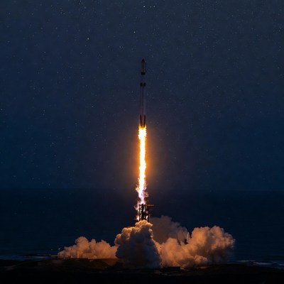 Rocket Launching at Night Over Ocean
