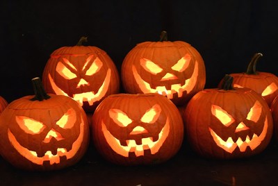 Group of lit jack-o-lantern pumpkins
