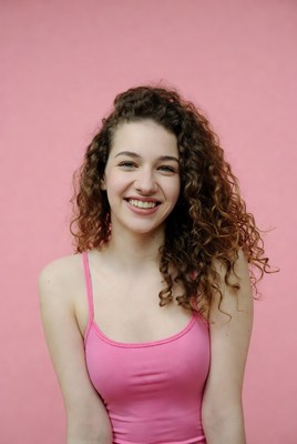 Smiling woman with curly hair