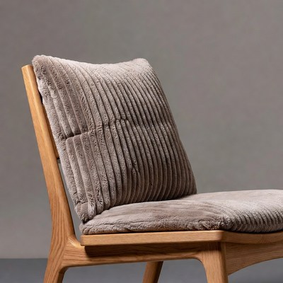 Wooden chair with gray fur cushion