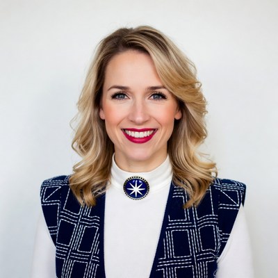 Smiling blonde woman in navy vest