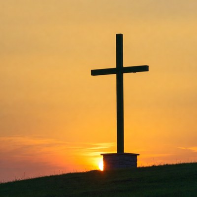 Wooden cross silhouette at sunset