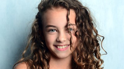 Smiling girl with curly hair