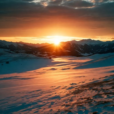 Sunset over snowy mountains