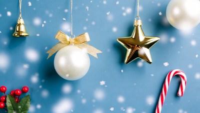 Christmas ornaments on blue snowy background