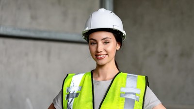 Woman in hard hat and hi-vis vest