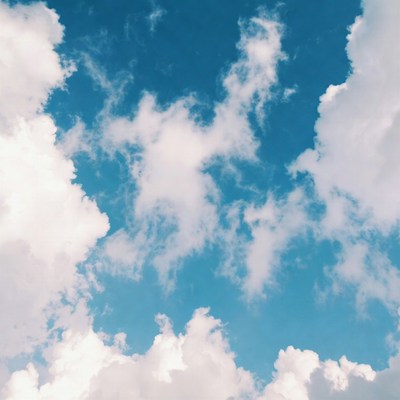 Fluffy Clouds in Blue Sky