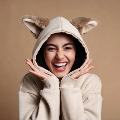 Asian woman in cat ear hoodie smiling