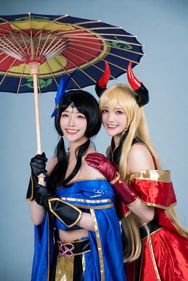 Two women in blue and red cosplay with umbrellas