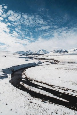 Snowy River Winding Through Mountains
