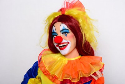 Female Clown Smiling on White Background